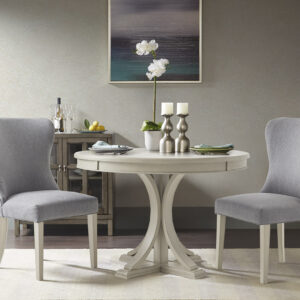 Make a statement in your dining room with the Madison Park Signature Helena Round Dining Table. This table features a wood veneer table top and solid wood pedestal legs. To accentuate the curves of the table it is coated in an antique cream finish. The round table seats four people comfortably. Leg assembly required