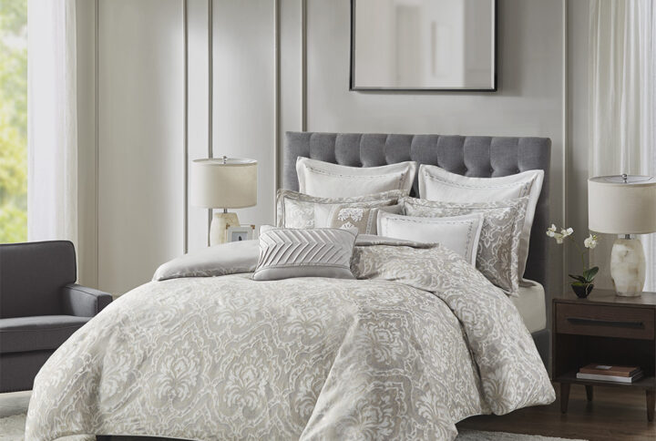 Introduce a luxurious allure to your bedroom with the Madison Park Signature Manor King 9 Piece Comforter Set. The comforter flaunts a shiny metallic damask jacquard weave