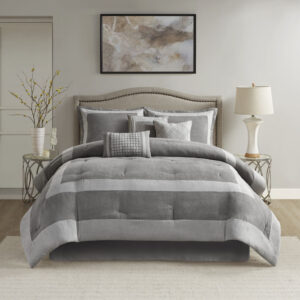 The Madison Park Dax 7 Piece Microsuede Comforter Set brings a rich and elegant update to your bedroom. This gray microsuede comforter and 2 matching shams feature a unique pieced color blocking design to create a luxurious modern allure. A solid bed skirt coordinates handsomely with the comforter