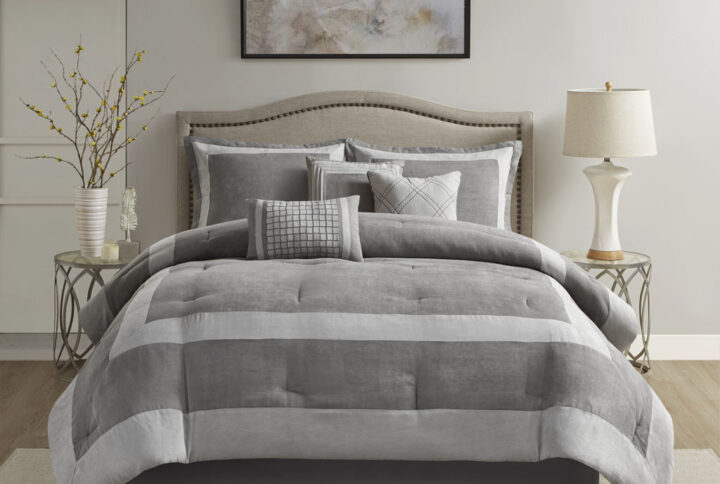 The Madison Park Dax 7 Piece Microsuede Comforter Set brings a rich and elegant update to your bedroom. This gray microsuede comforter and 2 matching shams feature a unique pieced color blocking design to create a luxurious modern allure. A solid bed skirt coordinates handsomely with the comforter