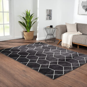 Elevate your home with the modern flair of Madison Park’s Averie Trellis Geometric Black and Cream Woven Area Rug. Made in Turkey