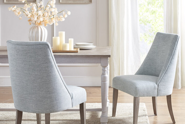 Complete your dining room decor with the Martha Stewart winfield cining chair set of 2. Each dining chair is upholstered and features a reclaimed finish on the solid wood legs