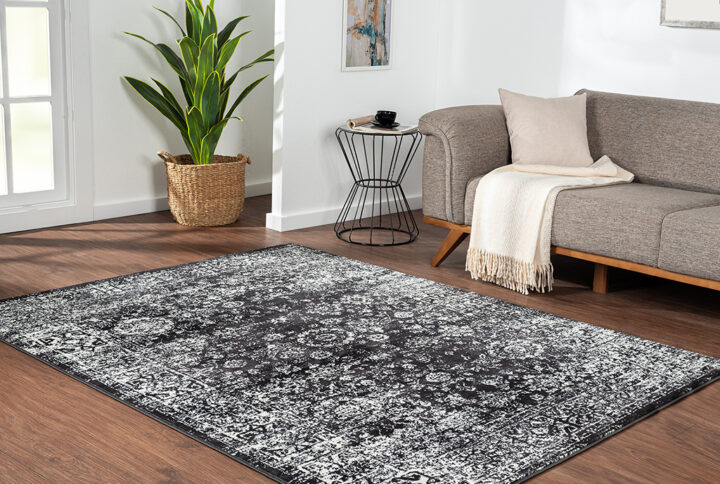 The Madison Park Chadwick Distressed Vintage Persian Black and Cream Woven Area Rug brings bold color and style to your home. This Persian-inspired rug features a distressed vintage design in contrasting shades of black and cream