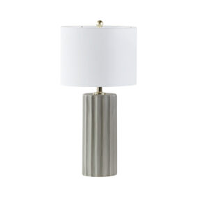 for a refined modern look. The white linen drum shade softly filters light to perfectly illuminate your space and is not adjustable. This table lamp also has a rotary on-off switch and brings a chic and subtle style to your living room or bedroom. One Type A light bulb is needed and included. Spot clean only. Comes with a 2-year warranty.