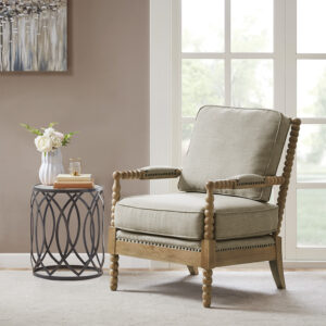 The Madison Park Donohue Accent Chair provides an elegant and comfortable update to your decor. This accent chair is upholstered in a neutral light grey fabric that creates a timeless look. A bronze nail head trim and padded arm rests add the perfect touches to the design. The solid wood legs feature a camel oak wood finish to complement the rich upholstery. Beautifully designed