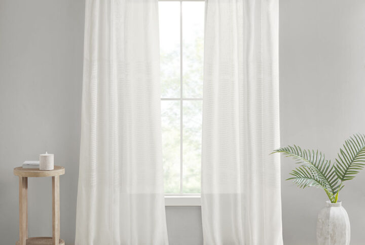 Create a soft and graceful allure in your home with the Madison Park Aida Yarn Dye Sheer Window Panel Pair. This sheer panel pair features a beautiful woven linen texture to create an airy look that drapes softly from your window; while handcrafted detailing creates a beautiful tonal color block pattern