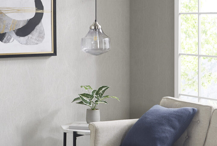 The Elm Pendant by Hampton Hill offers a bright and eye-catching update to your kitchen or dining room. This hanging pendant light features a bell-shaped glass shade with smoke grey color to create a stunning farmhouse look. An antique brass ceiling mount provides a complementary touch to the single bulb pendant