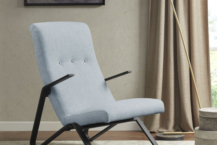 The Martha Stewart Manhattan Accent Chair introduces a simple yet sophisticated update to your living room. This sleek accent chair is upholstered in a light blue fabric and features slender metal arms and legs