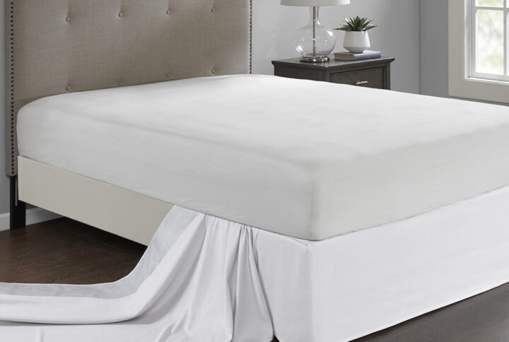 Give your bed the perfect finish with the Madison Park Simple Fit Wrap-Around Adjustable Bed Skirt. The solid white bed skirt features a hidden fabric band with a non-skid backing to keep it in place. Simply tuck and fold the bed skirt along the edge of the box spring to find the proper fit for your bed