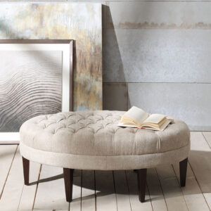 Prop up your feet and relax with the Madison Park Martin Surfboard Tufted Ottoman. This upholstered oval-shaped ottoman features a button tufted top that adds an elegant modern look. Solid wood straight legs with dark finish create a rich and striking contrast. Use this tufted ottoman as the perfect centerpiece in your living room to complete your decor. Only leg assembly is required. Spot clean or professional steam clean.