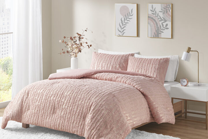 The Naomi comforter set features an eye-catching metallic design on soft faux fur that's sophisticated and modern. This faux fur comforter adds sparkle to your bedroom with its metallic accents