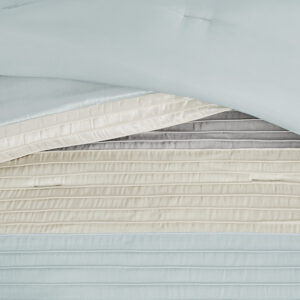 Amherst's modern color blocked design is a simple way to add style to your room. This comforter is covered in larges stripes in shades of aqua and grey. Made from polyester jacquard and a brushed fabric reverse this comforter is soft to the touch and is machine washable for easy care. The comforter set includes two matching standard shams and three decorative pillows that accent the color blocked look.