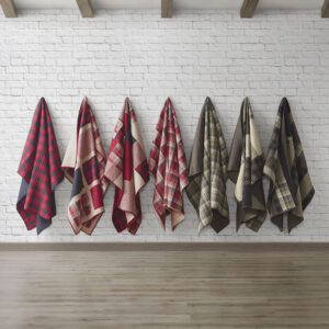 The Woolrich Tasha quilted throw features an all over black and red buffalo check and reverses to a solid black color. Made from 100% cotton this lightweight throw is soft to the touch and can be used year round.