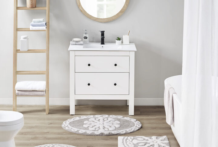 Bring a modern bohemian touch to your space with the Madison Park Casablanca Medallion Cotton Tufted Bath Rug. Featuring an alluring medallion design