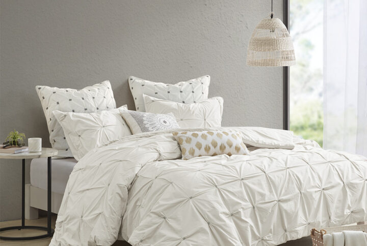 Elevate your bedroom with the INK+IVY Masie 3 Piece Elastic Embroidered Cotton Comforter Set. This solid cotton comforter features elastic and embroidered details on the face to create a tufted-inspired design with a modern flair. Hidden bartacking in the comforter secures the filling and creates a clean duvet-like finish. The 2 matching shams handsomely pair with the cotton comforter to complete this modern and sophisticated comforter set. This cotton bedding set uses an antimicrobial treatment that provides built-in freshness protection