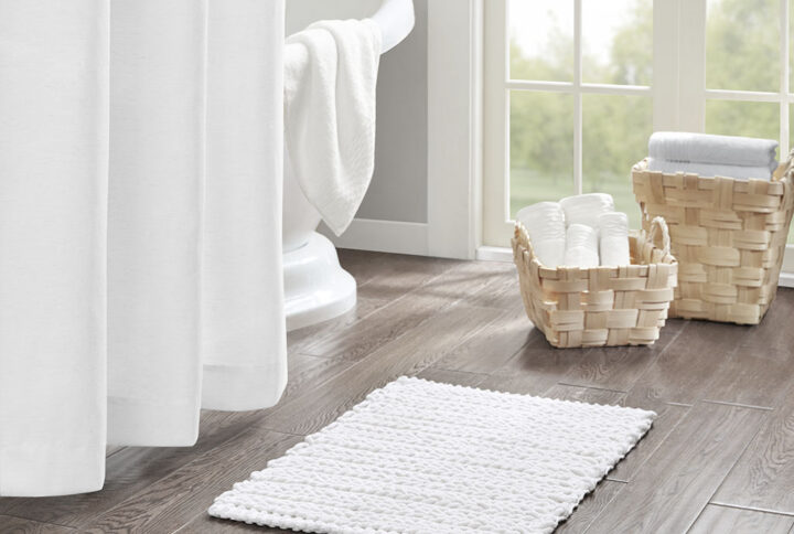 The Madison Park Lasso 100% Cotton Chenille Chain Stitch Rug provides a soft textural update to your bathroom decor. This cotton chenille bath rug features a woven chain stitch design that creates dimension and texture