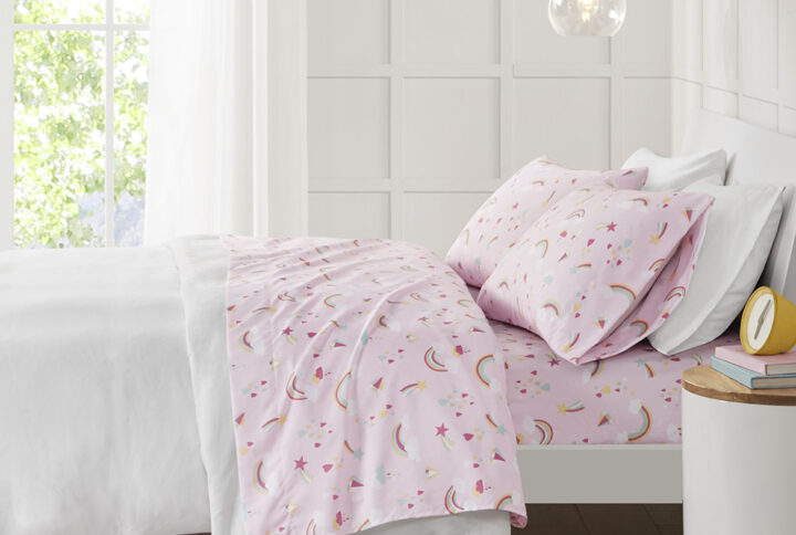 The Mi Zone Printed Sheet Set brings a delightful and charming update to your child's bedroom. This ultra-soft microfiber sheet set is naturally wrinkle-free and features an adorable rainbow on a pink background