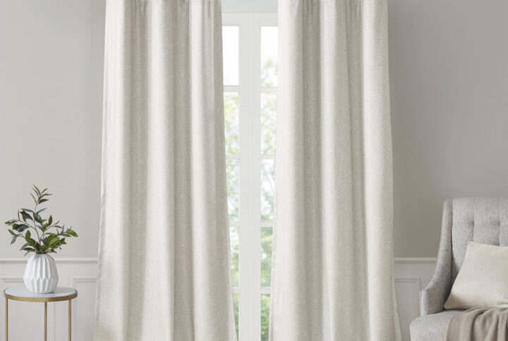 Elevate your decor with the modern style and function of our SunSmart Como Tonal Printed Faux Silk Room Darkening Panel Pair. This curtain pair flaunts a tonal hue on a faux silk textured fabric that creates a beautiful and rich modern look. Registered with OEKO-TEX certification