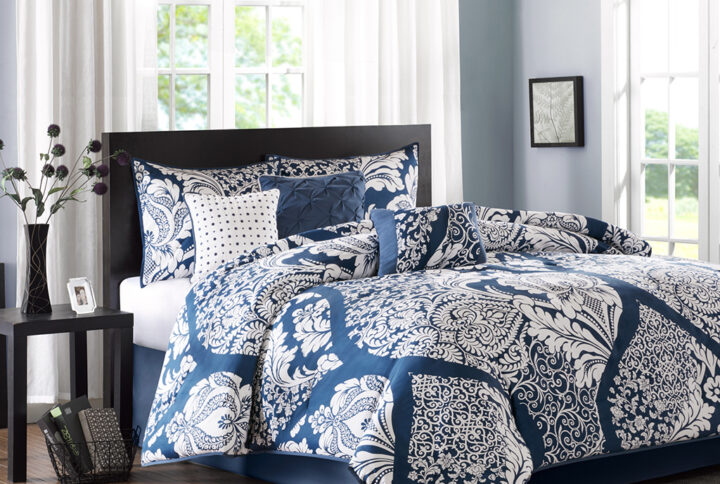 The Madison Park Vienna 7 Piece Cotton Printed Comforter Set offers an eye-catching update to your bedroom decor. A beautifully intricate damask pattern is flaunted across the comforter and shams