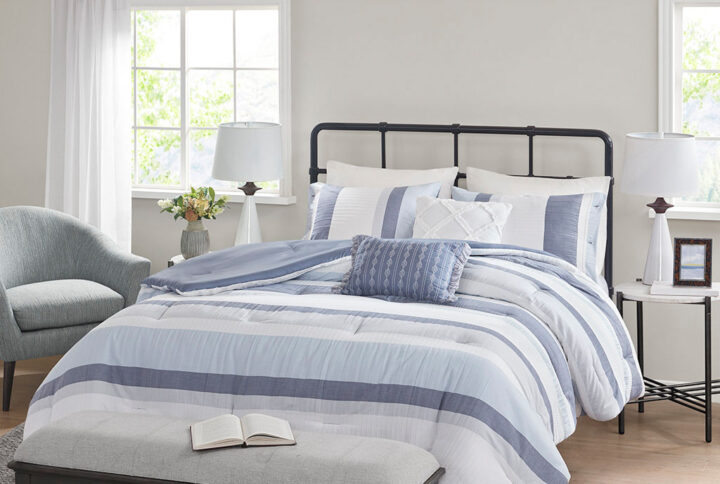 Refresh your bedroom with the casual charm of Madison Park’s Allegany 5 Piece Jacquard Comforter Set. The jacquard comforter features a striped design