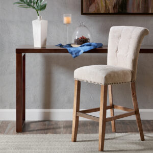 Elegant bronze nail heads add an extra touch of dignified style to this roll back button tufted bar stool. Assembly required.