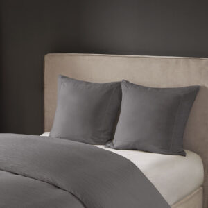 Complete your beautiful bedding set with the N Natori Hanae Euro Sham. This luxurious Euro sham features a cotton blend grey yarn-dyed fabric with decorative flange for a detailed textural appeal. A hidden zipper opening creates a clean edge that keeps your pillow secure. With its simple design