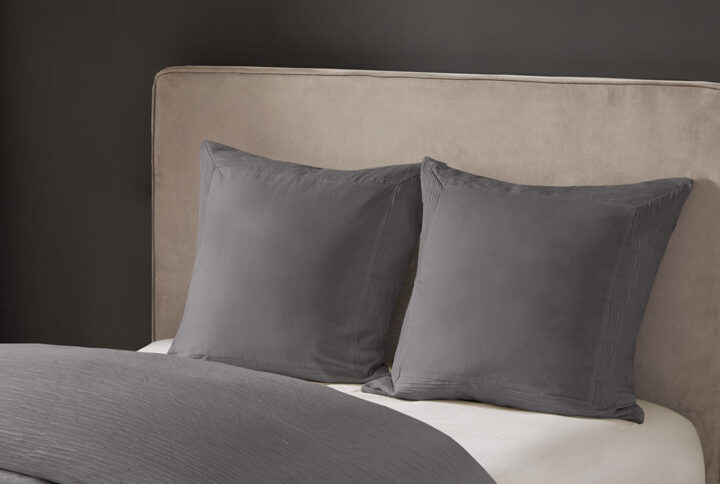 Complete your beautiful bedding set with the N Natori Hanae Euro Sham. This luxurious Euro sham features a cotton blend grey yarn-dyed fabric with decorative flange for a detailed textural appeal. A hidden zipper opening creates a clean edge that keeps your pillow secure. With its simple design