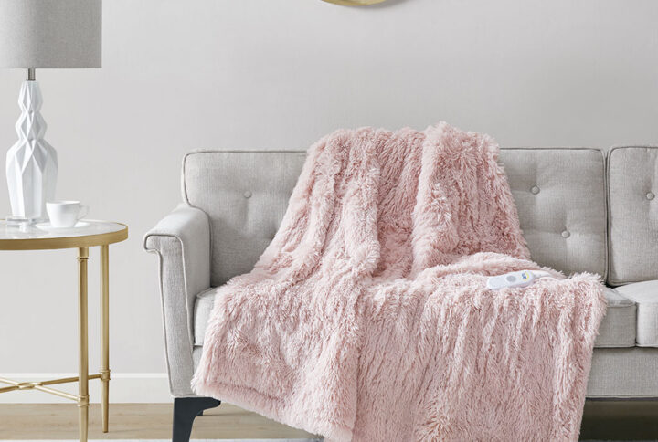 The Serta Malea Shaggy Faux Fur Heated Throw offers a rich textural touch to keep you warm and cozy. This heated throw flaunts an ultra-soft shaggy fur face that flips to a plush reverse to create an incredible soft look and feel. A single controller has 5 heat settings to easily find your preferred comfort level and the 3 hour auto shut off timer ensures your safety. Machine washable for easy care