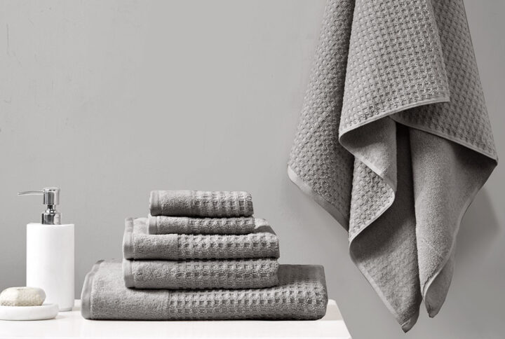 Our Madison Park Spa Waffle Cotton Towel 6 Piece Set provides the perfect textured update to your bathroom decor. This 100% cotton towel set features an all-over waffle combed jacquard design for a rich texture