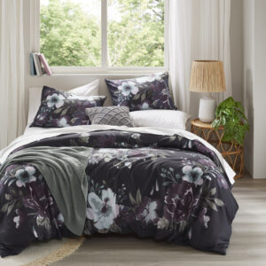 Transform your bedroom into a serene retreat with the Madison Park Jolene 3 Piece Cotton Floral Printed Duvet Cover Set. This King/Cal King duvet cover set features a dark grey and plum floral pattern on a 100% cotton face