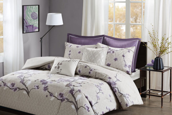 The Madison Park Holly 7 Piece Cotton Duvet Cover Set will transform your bedroom décor with charm and elegance. The cotton sateen fabric has a greyish taupe diamond background with a lovely floral print in purple