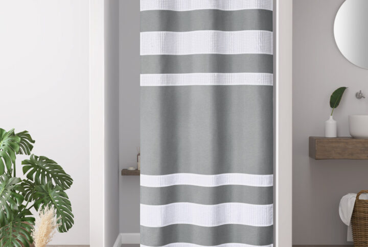 Update your space with the Madison Park Spa Waffle Shower Curtain with 3M Treatment. Featuring a fresh and updated stripe design