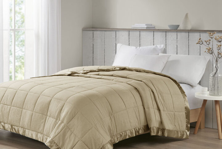 Make every night a cozy one with this textured oversized down alternative blanket. The color-matched 3" satin trim adds a luxury element that feels great on your skin. It features a 3M Scotchgard Moisture Management Treatment that wicks away moisture while helping release stains. Machine washable for easy care with a classic box quilting design. This hypoallergenic blanket is also OEKO-TEX certified