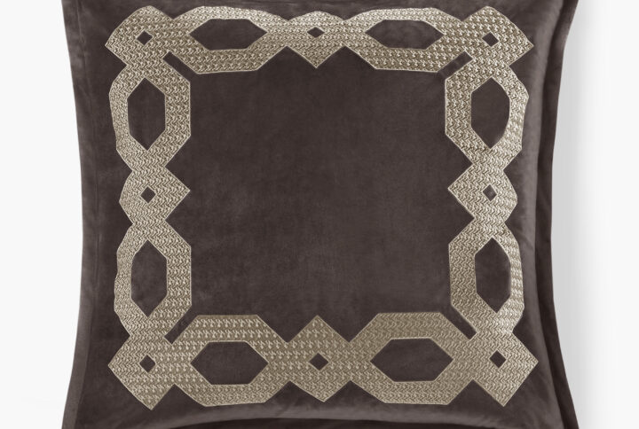 This decorative frame element is derived from geometric shapes and embroidered with metallic yarn using bold stitching lines. The luxurious velvet presents layered and varied color tones from different angles. It is soft to the touch and enjoyable to the eyes.