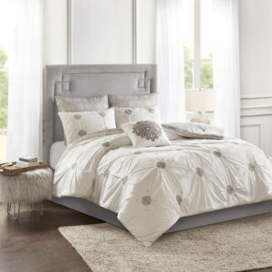 Style your bedroom with the shabby chic allure of the Madison Park Malia 6 Piece Embroidered Cotton Reversible Comforter Set. The face of the reversible comforter features tufted grey embroidery on an ivory base