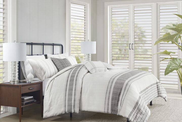 Introduce an upscale cottage charm to your bedroom with the Harbor House Morgan 5 Piece Cotton Duvet Cover Set. This 100% cotton jacquard duvet cover features textured vertical woven stripes with contrasting horizontal blue stripes on white ground