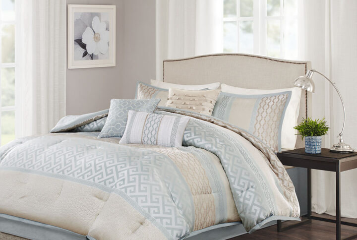 The Madison Park Bennett 7 Piece Jacquard Comforter Set provides a peaceful update to your bedroom with its soft shades of neutral colors. The geometric woven designs adorn this collection working together in large and small stripes for an updated traditional look. Three decorative pillows use embroidery and fabric manipulation techniques for a cohesive look in your space. Items in the set may come in a rolled or compressed packaging