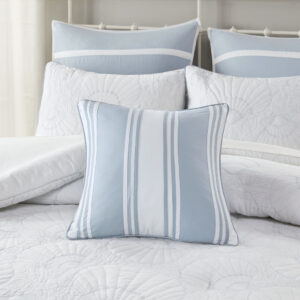 Add a fresh accent to your bedroom with the Harbor House Crystal Beach Pieced Square Pillow. This cotton decorative pillow features a pieced design of solid white and blue fabric