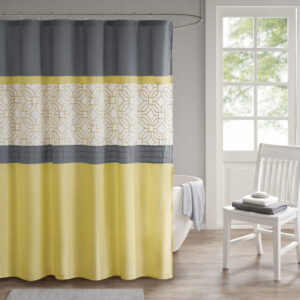 The 510 Design Donnell Embroidered and Pieced Shower Curtain offers a fresh update to your bathroom. A pintucked and pieced design is featured in grey and yellow hues