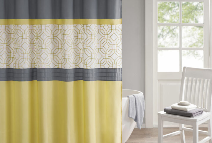 The 510 Design Donnell Embroidered and Pieced Shower Curtain offers a fresh update to your bathroom. A pintucked and pieced design is featured in grey and yellow hues