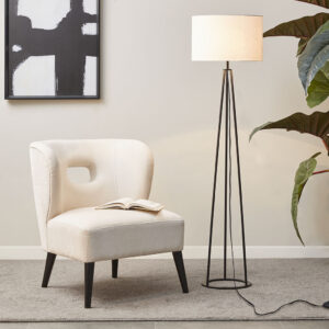 The Martha Stewart Clyde Metal Tripod Floor Lamp 60"H offers a simple and modern update to elevate your living room decor. This floor lamp features a metal tripod base in a matte black finish that creates a slender and sleek contemporary look. The drum shade is not adjustable and is made from white linen to softly filter light and provide a chic contrast to the base of this floor lamp. This tripod floor lamp also uses a foot switch and gives your home a sharp modern accent. 1 Type A light bulb is needed(not included). Spot clean only. Comes with a 2-year warranty.