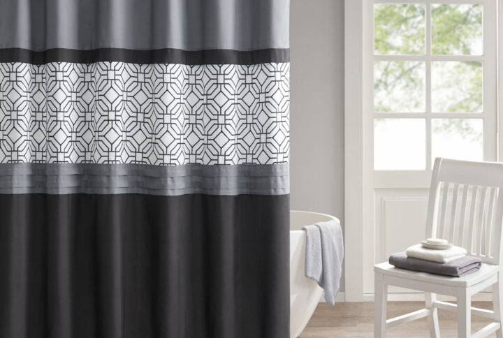 The 510 Design Donnell Embroidered and Pieced Shower Curtain offers a fresh update to your bathroom. A pintucked and pieced design is featured in grey and black hues