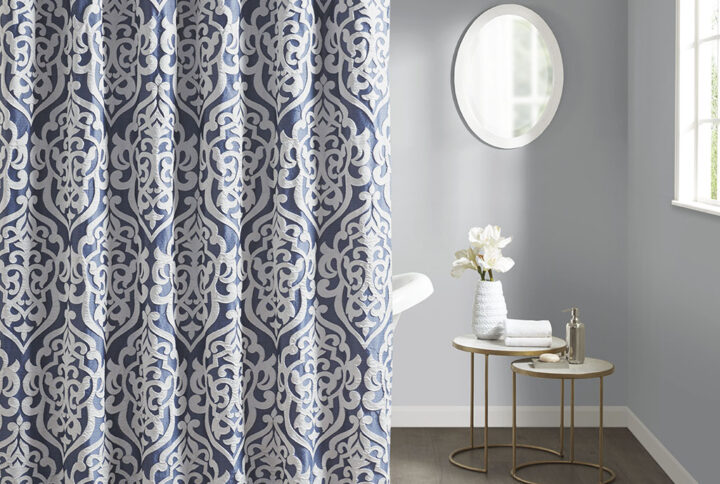 Add a touch of class to your bathroom with our Madison Park Odette Jacquard Shower Curtain. This luxurious textured shower curtain flaunts a gorgeous silver damask medallion design on a stria navy jacquard ground that adds rich texture and dimension to the lavish look. Measuring 72x72"