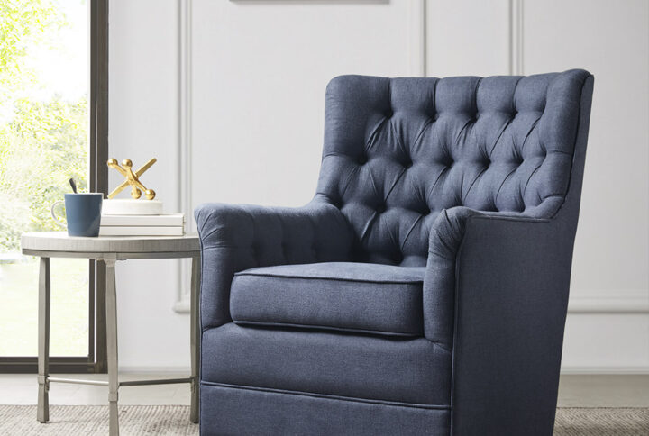 Relax in the comfort and style of the madison park mathis swivel glider chair. This swivel chair is upholstered in a soft fabric with a hand-tufted back to create a traditional look. The swivel glide base allows the chair to rotate 360 degrees