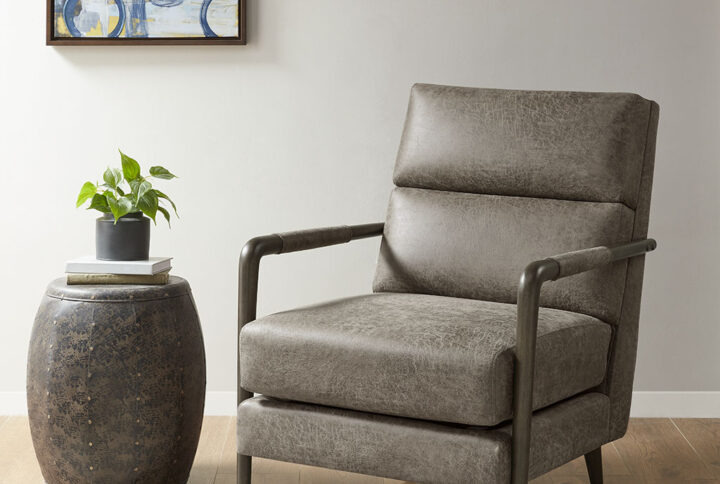 Add sharp sophisticated style to your home with the Madison Park Gavin Faux Leather Channel Accent Armchair. This accent chair features an upholstered seat and back in brown faux leather fabric with wide horizontal channel stitching