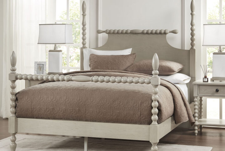 Dramatic turned post bed featuring a rolling pin style