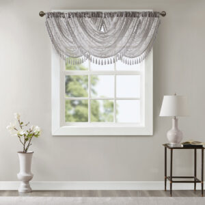 adding grace and charm to your décor. The neutral colors and light fabric helps create a delicate look to soften any room