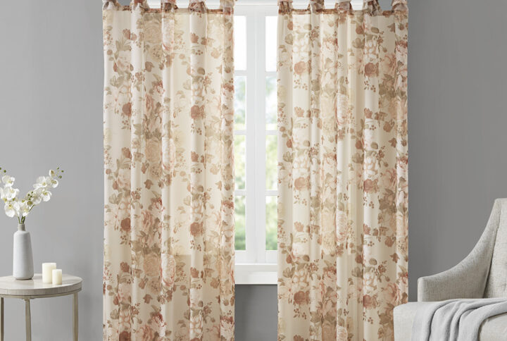 The Madison Park Simone Printed Floral Twist Tab Top Voile Sheer brings a soft and romantic touch to your home decor. This voile sheer curtain panel features a beautiful blush printed floral on a neutral ground for a rich and stylish contrast