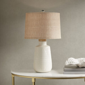 Fun details and unique style bring the INK+IVY Tate Boho Textured Ceramic Table Lamp to life. A subtle white ceramic base is complimented with touching V shapes and a natural wood top. This is a lamp that can be used in a multitude of decors. The natural tan textured shade and round finial round out this lamp.