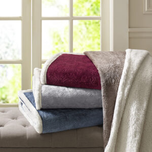 This super soft plush throw features a textured design that adds dimension to the throw. The reverse features a cozy berber to keep you warm. It's also oversized for added warmth and comfort.